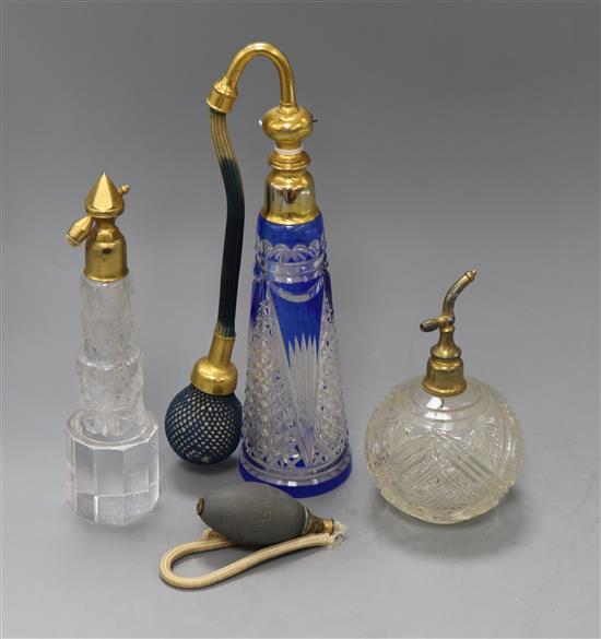 Two Bohemian glass atomisers and another atomiser